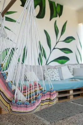 a hanging hammock in a room with a bed at Sea City and Mountain View Apartment in Chania Town