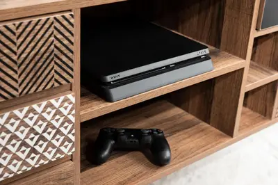 a video game console and a game controller on a shelf at Vista del Puerto in Chania Town