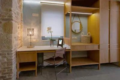 a dressing room with a desk and a mirror at Koum Kapi Boutique Apartments in Chania Town