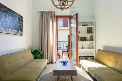 a living room with two couches and a table at Centro Storico in Chania Town