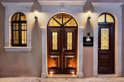 a building with two doors and two windows at Neorion Living in Chania Town