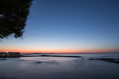 a view of a beach at sunset at SanSal Boutique Hotel in Chania Town