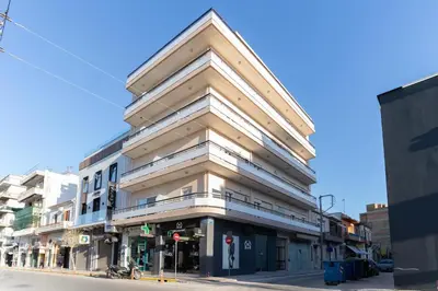 a building on the corner of a city street at Helios Residence in Chania Town