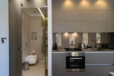 a kitchen with a sink and a stove at Xenios Dias Luxury Apartments With Sea View in Kato Daratso