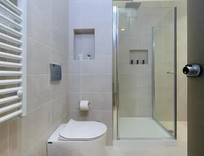 a bathroom with a toilet and a glass shower at Xenios Dias Luxury Apartments With Sea View in Kato Daratso