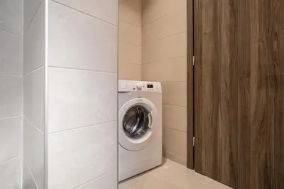 a washer and dryer in a small room at Casa Ntore Luxury Apartments in Chania Town