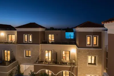 a view of a building at night at Okeanis Golden Resort in Kato Daratso