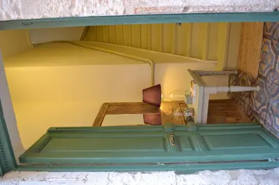 a doll house with a bed and a chair in it at Antica Casa Studios in Chania Town