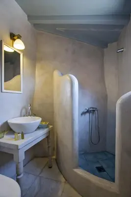 a bathroom with a sink and a shower at Fagotto Art Residences in Chania Town
