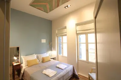 a bedroom with a bed with two towels on it at Fagotto Art Residences in Chania Town