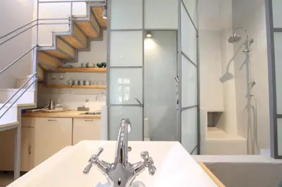 a bathroom with a sink and a shower at Fagotto Art Residences in Chania Town