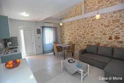 a living room with a couch and a table at Casa di Mona in Chania Town