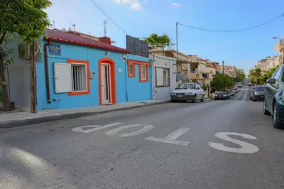 a blue building on the side of a street at Casa di Mona in Chania Town