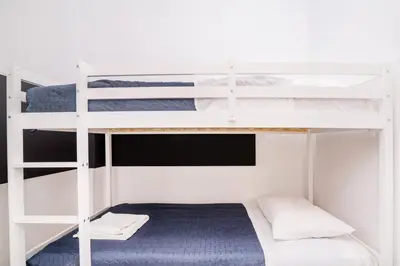 a bunk bed room with two bunk beds at Pearl Seaside Cozy Apartments in Chania Town