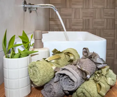 a bathroom counter with a sink and a towel at Elenas Home - Dream & Love apts w Private pool in Alikianós