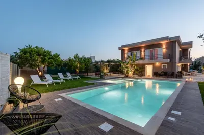 a swimming pool in the backyard of a house at Elenas Village House - Love apartment with Pool and Terrace in Alikianós