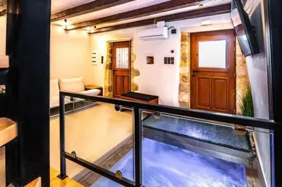 an indoor aquarium in a room with a balcony at Casa Bene in Chania Town