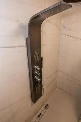 a shower with a shower head in a bathroom at Casa Bene in Chania Town