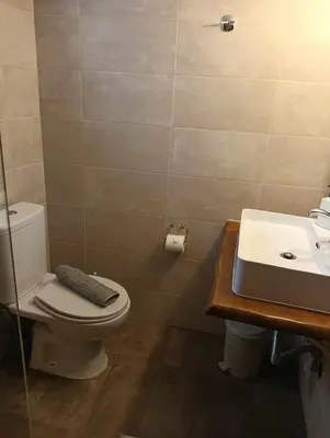 a bathroom with a toilet and a sink at Chania Nice Apartment in Chania Town