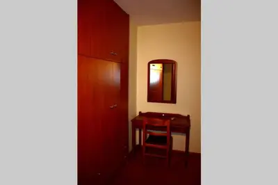 a room with a table and a mirror and a table at Kaktos 1 in Kissamos