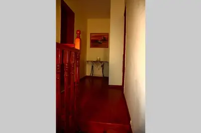a hallway with a staircase and a table in a room at Kaktos 1 in Kissamos