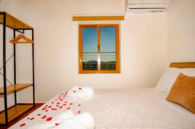 a bedroom with a bed with red hearts on it at Trouli Rokka House in Kissamos