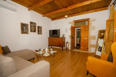 a living room with a couch and a table at Trouli Rokka House in Kissamos