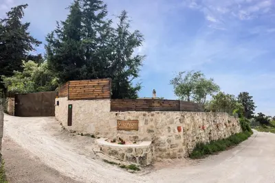 a stone building on the side of a road at Villa Aloni in Fílippos