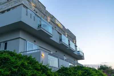 a building with lights on the side of it at Abella Hotel in Agia Marina Nea Kydonias