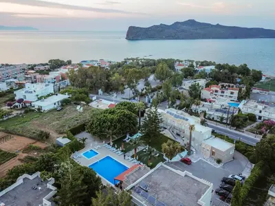 an aerial view of a city and the ocean at Abella Hotel in Agia Marina Nea Kydonias
