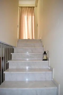 a set of stairs in a house with a window at Four Seasons Homes in Stalos