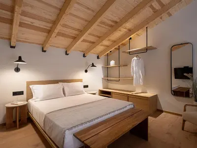 a bedroom with a bed and a dresser and a mirror at Casa Dei Miracoli in Chania Town