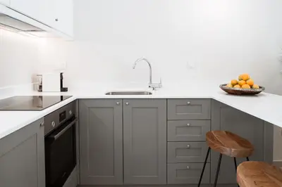 a kitchen with a sink and a bowl of oranges at Casa Dei Miracoli in Chania Town