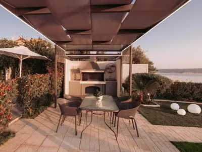 a patio with a table and chairs under a roof at Blue Green Villa Kalyves eco pool premium quality in Kalyves