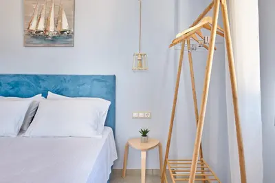 a bedroom with a ladder next to a bed at Blue Green Villa Kalyves eco pool premium quality in Kalyves