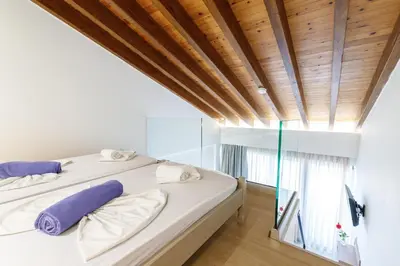 a bedroom with a bed and a wooden ceiling at Kostakis Beach in Gerani Chanion
