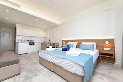 a large bedroom with a large bed and a kitchen at Kostakis Beach in Gerani Chanion