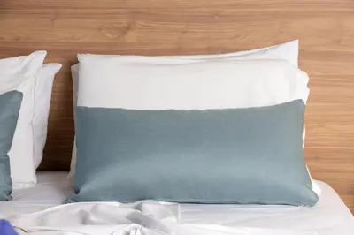 a stack of pillows on a bed at Kostakis Beach in Gerani Chanion