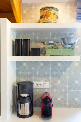 a coffee maker on a shelf in a kitchen at Villa Skyphos in Ammoudari