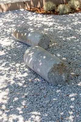 a pair of cement shoes sitting on the ground at Villa Skyphos in Ammoudari