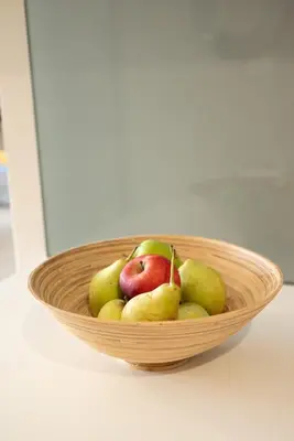 a basket of apples and pears on a table at Calme luxury residence in Chania Town
