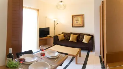 a living room with a couch and a table at Nicky Apartments Chania in Chania Town