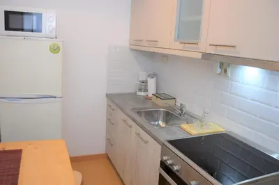 a kitchen with a sink and a counter top at Chania 1548 Old Town Apartments in Chania Town