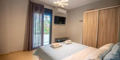 a bedroom with a bed with two towels on it at On the sand 2 in Palaiochóra