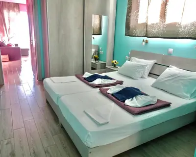 a bedroom with a bed with two towels on it at Faros apartment in Sfakiá