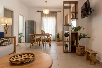 a living room with a couch and a table at eden of grameno in Palaiochóra