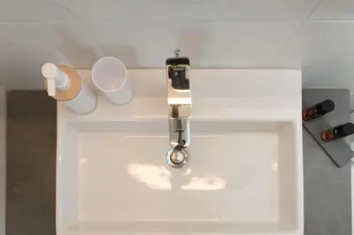 a sink with a water faucet in a bathroom at eden of grameno in Palaiochóra