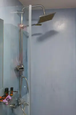 a shower in a bathroom with a shower head at Charming Flatlet in the Old Town in Chania Town