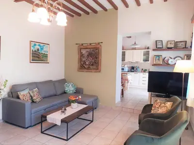 a living room with a couch and a tv at George's House between Falasarna and Balos in Kissamos
