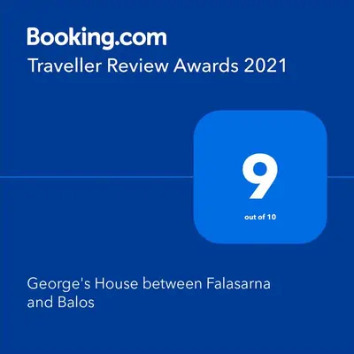 a screenshot of a phone with a travel review awards at George's House between Falasarna and Balos in Kissamos